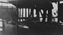 Looking out from the inside through the unfinished exterior walls of the International Bitumen Company separation plant, ca. 1930<br/>Source: Provincial Archives of Alberta, PR1968.0015.24-16