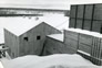 Oil sands were conveyed from the hopper (top right), through a concrete building (centre), to the separation plant (left), Alberta Government Oil Sands Project, ca. 1950.<br/>Source: Provincial Archives of Alberta, PR1968.0015.27-96