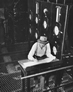 Recording readings from gauges monitoring the separation process, inside the separation plant at the Alberta Government Oil Sands Project, ca. 1950<br/>Source: Provincial Archives of Alberta, PR1991.0359.28