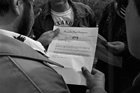 Chief Martin Arcand of the Alexander Band holds a letter informing him that Warren Allmand, Minister of Indian Affairs and Northern Development, has signed new regulations under The Indian Act, giving the Manager of Indian Minerals the authority to set a fair market value for natural resources extracted from wells on the Alexander Reserve, ca. 1977. The text of the letter reads: "The submission to treasury board and privy Council of new Indian Oil & Gas regulations was signed by me several days ago, and will be rushed for the earliest possible approval by Governor in Council. The new regulations will give authority to the Manager of Indian Minerals to set a fair market value for the royalty gas produced from the Alexander Reserve. Should the Alberta Minister of Energy & Natural resources not take measures to allow the Band a fair royalty return on gas production, I shall instruct the Manager of Indian Minerals to set a fair market value under the regulations." - Warren Allmand