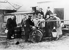 Visitors to Dingman No. 1 watch the barreling of naphtha direct from the well.