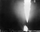 The well known as Royalite No. 4 blew in the spring of 1924. It took weeks to bring the well under control. Once controlled, its excess gas was flared off, brightening the night sky for miles around.