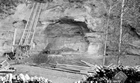 Tar sands for bituminous pavements, 1925; the location and character of Draper’s lease was advantageous for mining and shipping the resource that can be difficult to access. His block included a cliff face of exposed oil sands that could be removed using nothing more complex than a spade. Source: Canada. Dept. of Mines and Technical Surveys/Library and Archives Canada, PA-019904