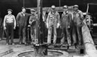Oil rig workers, Turner Valley, 1934; these men were fortunate to still have jobs. One worker who lived in Turner Valley at the time recalled, "you couldn’t buy a job or get one in 1934 for love nor money." <br />Source: Glenbow Archives, IP-15c-328